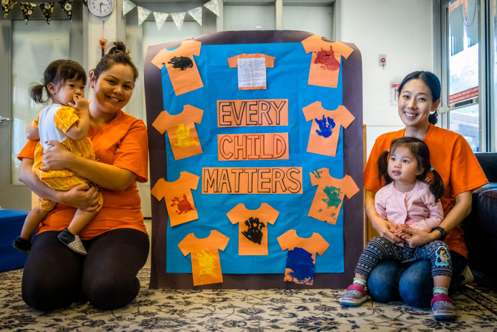 Staff members celebrate the message that every child matters during Kiwassa’s celebration of Orange Shirt Day.